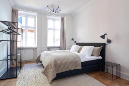 Rare 4BR Apartment w Unique Details in CPH City - image 24